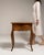 This 19th century Louis XV side table from France is finished in amber, worked in wood. It is distinguished by its...