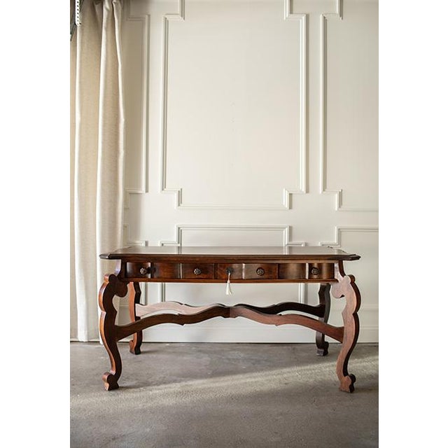 This Spanish Baroque inspired writing desk by Jim Peed for Romweber circa 1990s brings warmth and character to any space,...