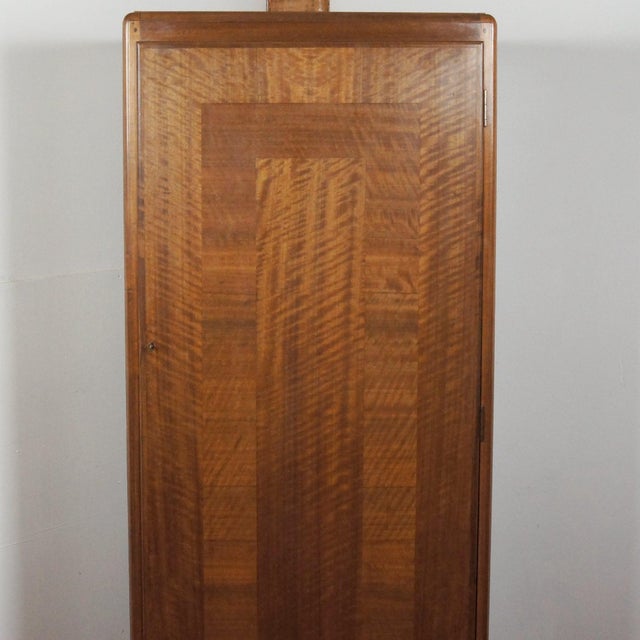 An Art Deco entrance hall Wardrobe by Betty Joel. Cross banded Australian walnut veneer with cedar lined interior and...
