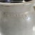 This piece is an antique salt-glazed stoneware crock stamped with the maker's mark N. CLARK & Co. / ROCHESTER N.Y.,...