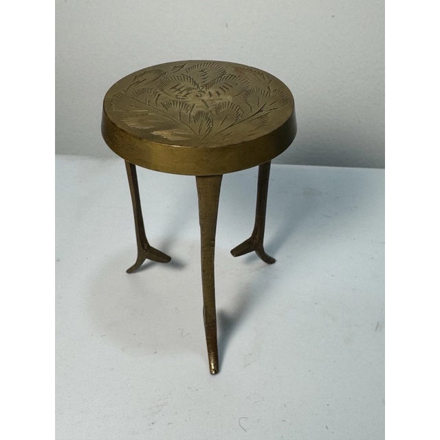 Vintage solid brass mini pedestal stand with etched round top and tripod-style legs. Ideal as a trivet, plant stand,...