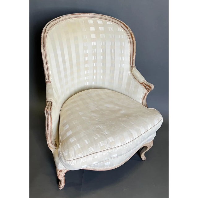 19th century French painted bergere beautifully upholstered in an off white fabric. The chair was recently acquired from...