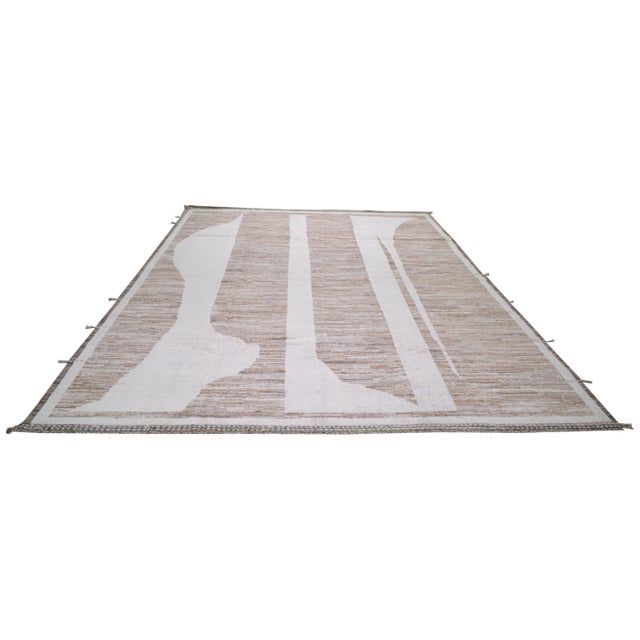 Hand-knotted with care using traditional rug making techniques, this wool rug blends timeless craftsmanship with a modern...