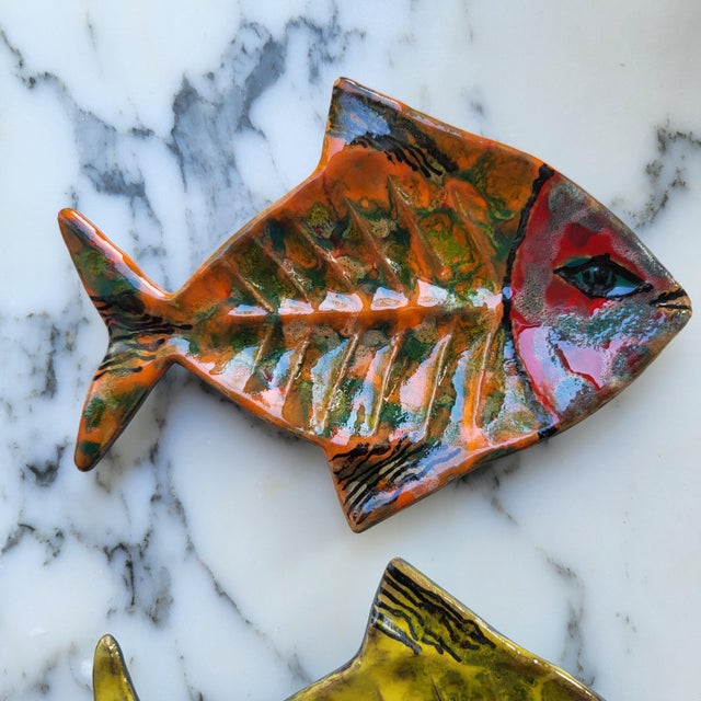 Set of three rare and exquisitely handcrafted and handpainted mid-century modern ceramic fish dishes from San Marino,...