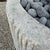Custom Limestone Texture Fire Pit With Fluted Edges With Fire Pebbles For Sale - Image 13 of 15