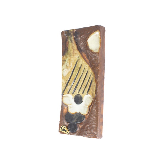 A ceramic wall plaque by Helmut Friedrich Schäffenacker (1921-2010). Made in Germany, this rectangular plaque features an...