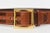 This fabulous never worn Italian Dolce and Gabbana leather belt has a brass buckle with 2 shades of brown leather. The...