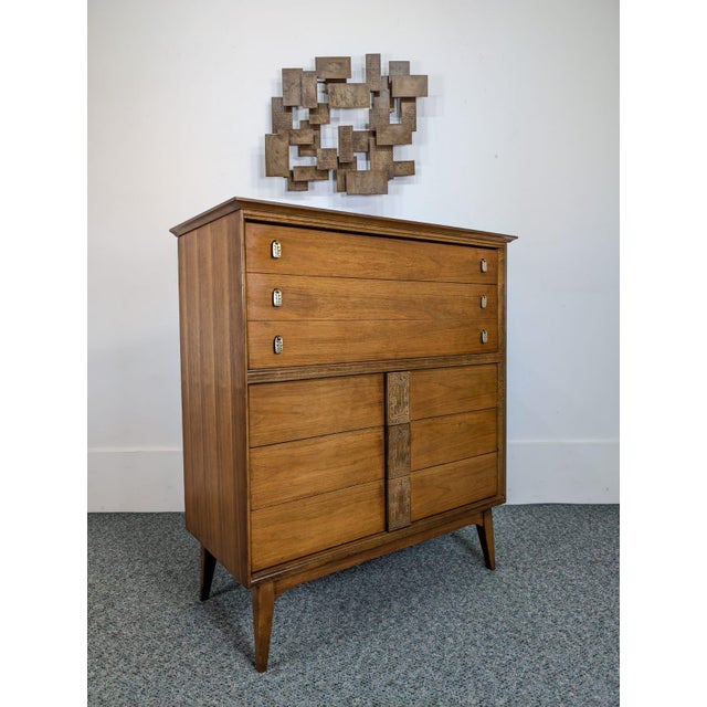 Beautiful MCM Mayan Collection highboy by designer Leo Jiranek for Bassett. Features 6 smooth gliding dovetailed drawers,...