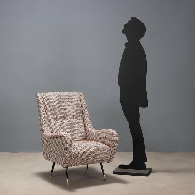 Armchair with foam padding, fabric upholstery, metal legs with brass tips. Very good condition, completely reupholstered....