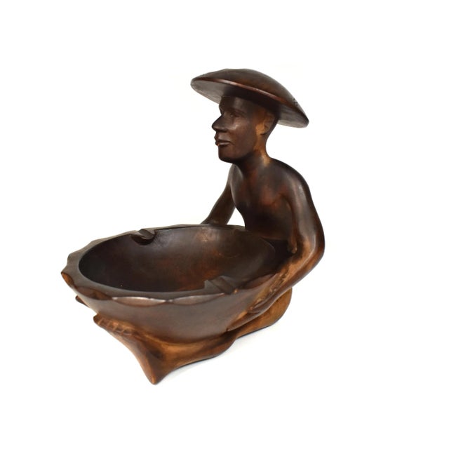 Unique rare hand carved solid wood sitting Asian man holding a bowl ashtray, this piece is a great addition to your home...