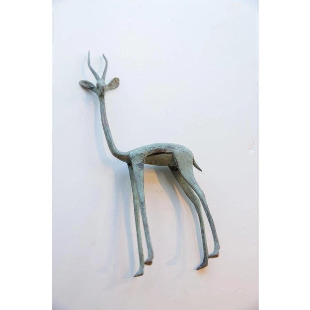 :: Vintage handmade African gazelle. Made approximately 40-70 years ago, each figure in this collection represents a...