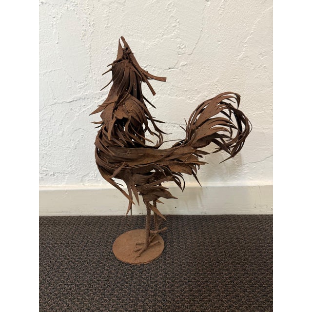 Explosive and full of movement, this welded steel rooster captures the wild kinetic energy of metal in motion. Layered,...