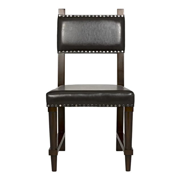 Beautifully hand crafted with hand-picked birch wood and upholstered with brown leather. This chair is perfect for any room!