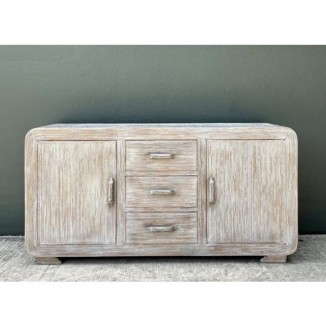 This vintage pencil reed credenza is a refined example of mid-century craftsmanship, blending clean architectural lines...