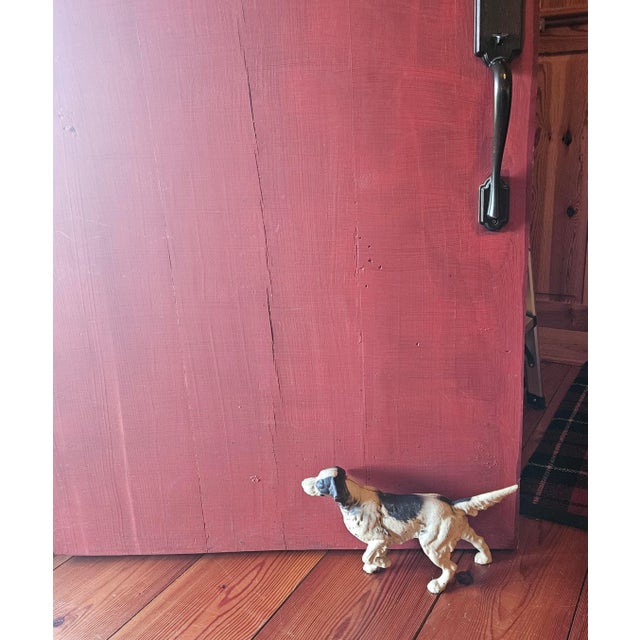 This vintage cast iron doorstop depicts a classic hunting dog, likely an English Setter or Pointer. Hubley was known for...