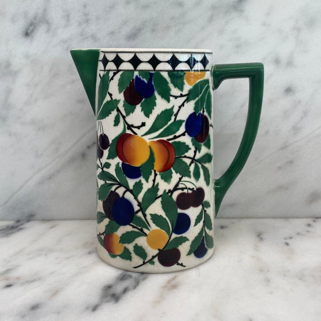 Antique Art Nouveau Villeroy Boch Wallerfangen Saar Basin pitcher. Decorated with a vibrant stylized fruit and foliage...