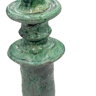 A Moroccan Tamegroute glazed candlestick holder is a handcrafted piece made in the historic pottery village of Tamegroute...