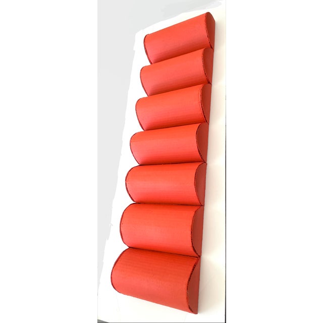 This unique wall sculpture features a row of undulating rounded shapes which can be hung vertically or horizontally. Made...
