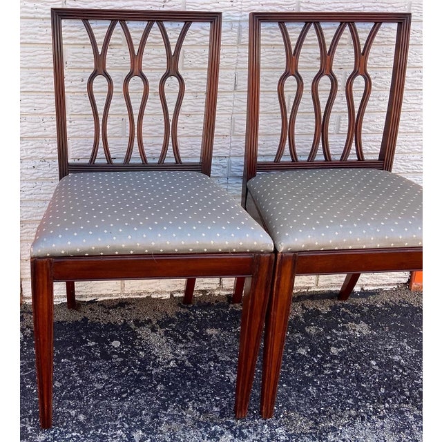 This us a lovely pair of vintage Lady Emily’s Invitation style side chairs. They feature rectangular backs enclosing...
