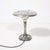 This Art Deco Machine Age saucer-form table lamp, crafted in polished aluminum with a sculptural base and originating from...