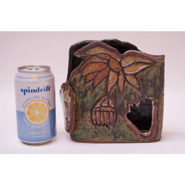 Floral motif stoneware vase made in 1974 by ceramicist, Pollack. Vivid color palette and intriguing pattern / textural...