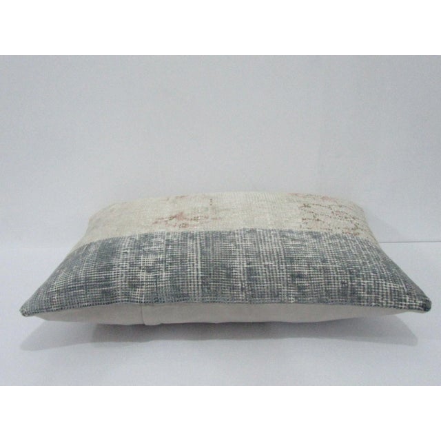 Decorative pillow cover made from a vintage Turkish handknotted rug. Backed with good quality cotton fabric. Pillow...