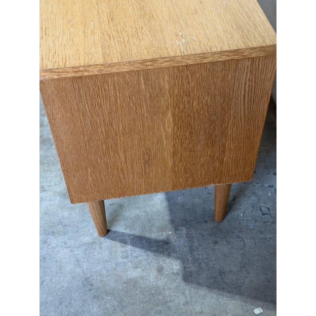 Minimalist vintage Danish modern media console or low cabinet crafted in oak with clean Scandinavian lines and tapered...
