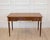 Made in France in the twentieth century, this Louis XVI style flat desk is constructed in wood, with two pull-out slides...