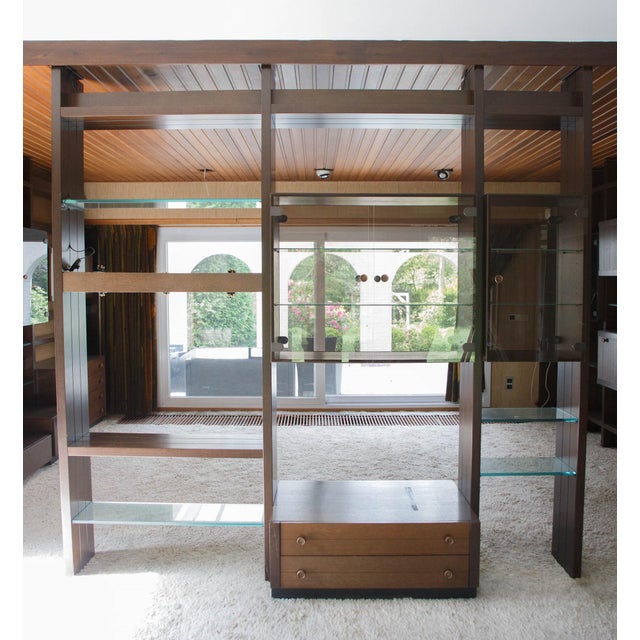 Vintage Omnia wall unit with large and small showcase, chest of drawers, and wooden and glass shelves. Made in Germany in...