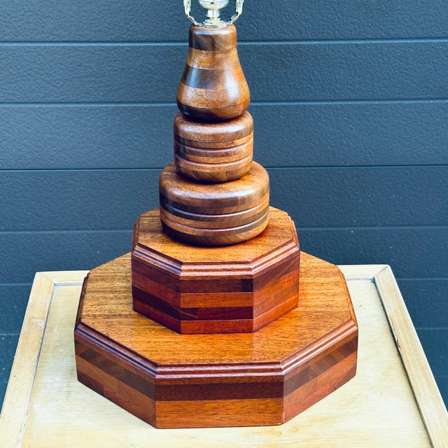 A unique hand crafted solid walnut wood table lamp with brass finial. 27.5” tall to top of finial 18” tall to top of bulb...