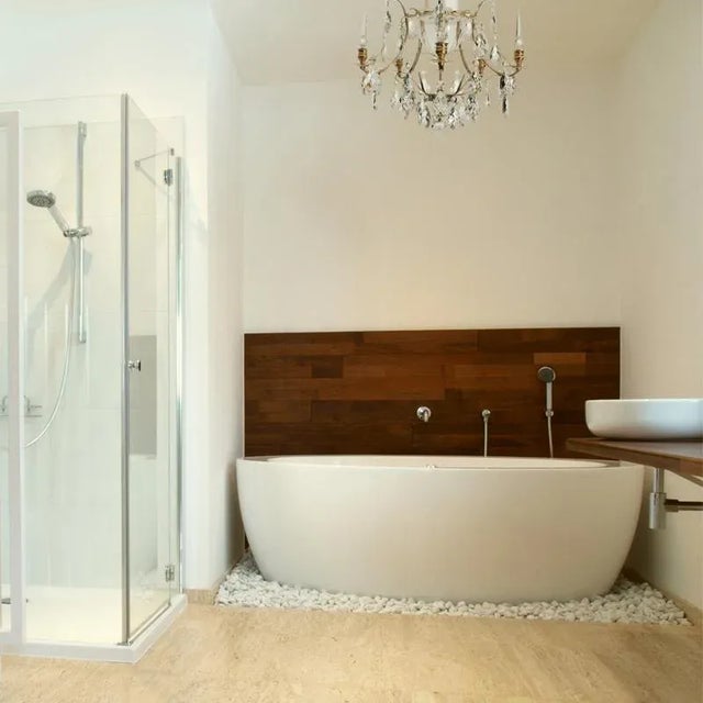 A polished brass bathroom chandelier with full cut crystal obelisques in the arms and cut crystal baroque almonds. The...