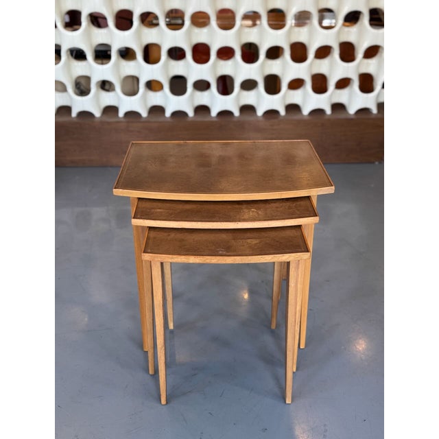 A beautifully designed authentic 1950’s set of American nesting tables. These table are all in original condition showing...