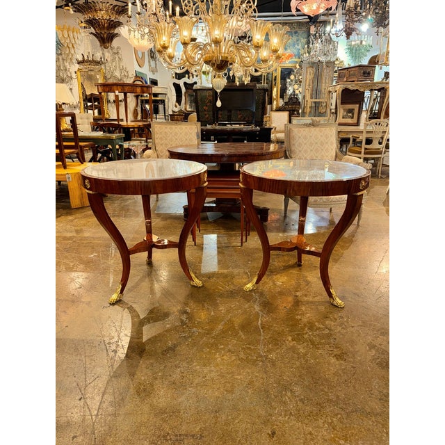 This pair of Italian Empire Style Mahogany Side Tables is a stylish addition to any living room. Made of high-quality...