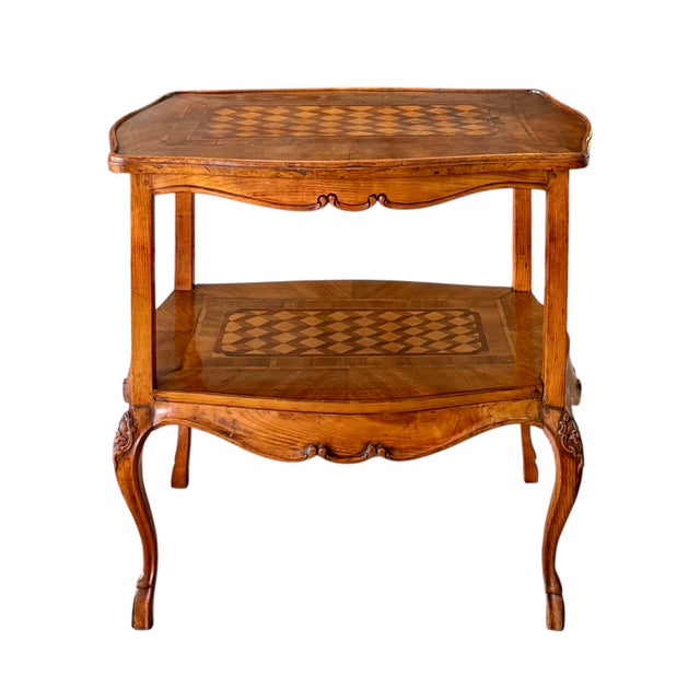 A fine fruitwood Louis XV side table; circa 1770. Delicate cabriole legs terminating in hoof feet and beautifully carved...