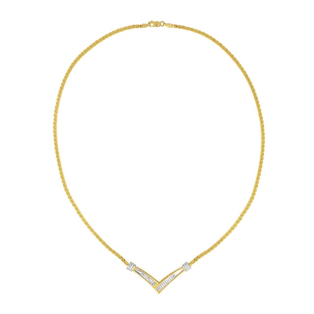 This stunning 10K yellow and white gold pendant necklace features a flared V shaped pendant inset with two rows of...