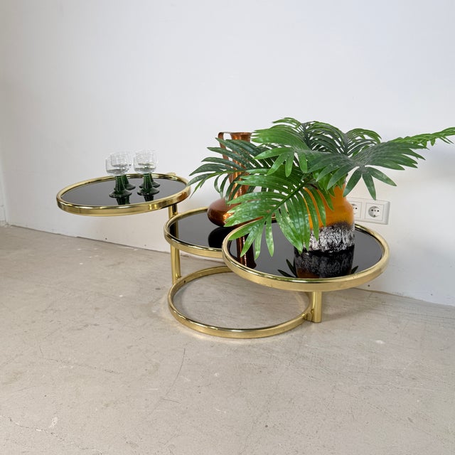 Stunning vintage "cascade" coffee table in glamorous Hollywood Regency style, originally sourced from Germany (1970s). The...