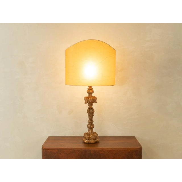Magnificent baroque table lamp from the 1960s. High-quality wooden frame with a beige lampshade. Handmade in Austria....