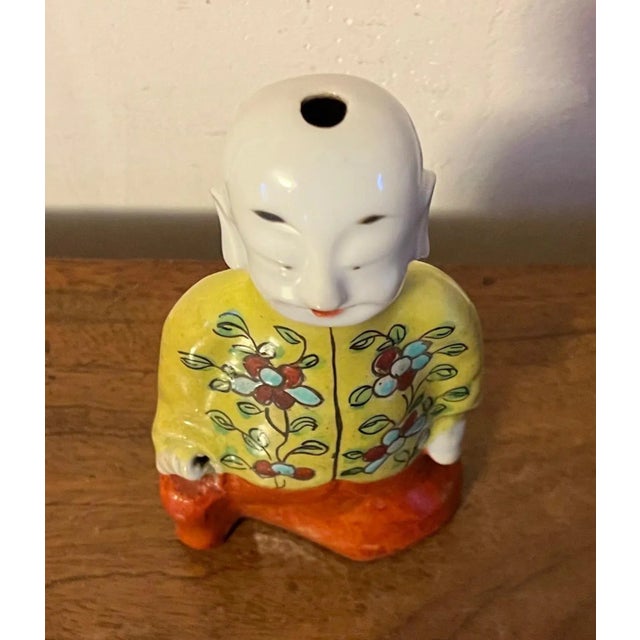 Antique 19th century Chinese export porcelain ho ho boy joss stick figure for incense. Dressed in a bright yellow tunic...