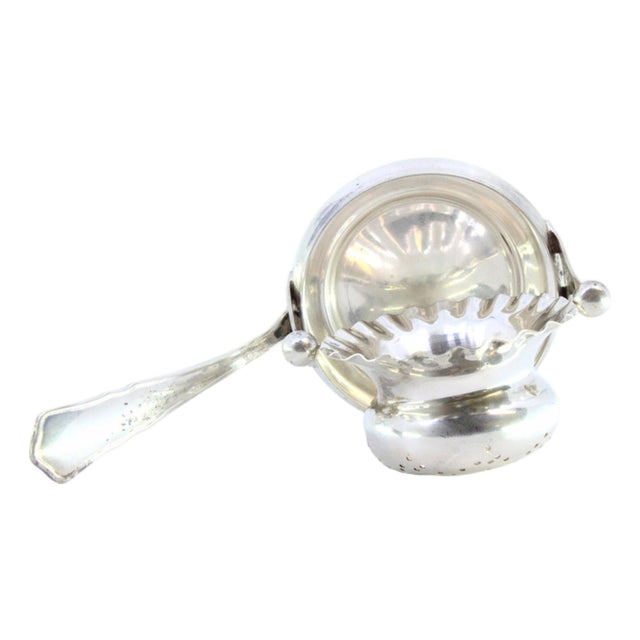 Silver Tea Strainer with Embossed Cup-Shaped Deposit and Ribbed Handle For Sale