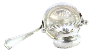 Silver Tea Strainer with Embossed Cup-Shaped Deposit and Ribbed Handle