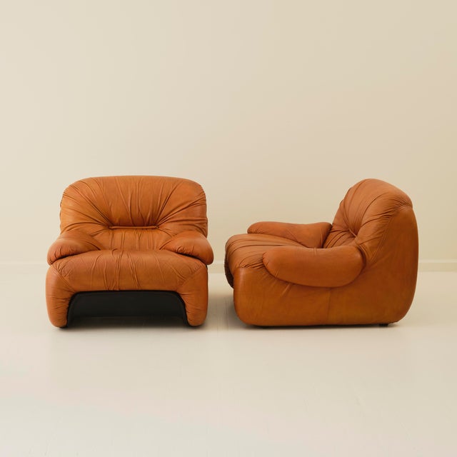 Pair of “Malu” armchairs, designed by Claudio Vagnoni and produced by 1P, Italy, circa 1970s. Upholstered in rich cognac...