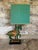 Beautiful Frederick Cooper Horse Tang lamp with original shade. Gorgeous blueish green color with gold accents. Comes with...