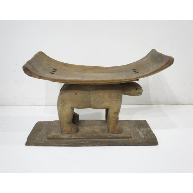 A hand carved wooden West African Ashanti animal stool or ottoman in the style of folk art probably made in Ghana , This...