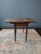 Well-loved antique drop-leaf table that would make an easy addition to a variety of spaces. Top has a weathered patina...