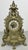 An elaborate Vintage French clock with an impressive architectural form, richly decorated with scrolling openwork, shell...