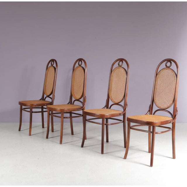 A beautiful set of four dining chairs, model “Long John,” manufactured by FMG in Poland in the 1950s. These elegant and...