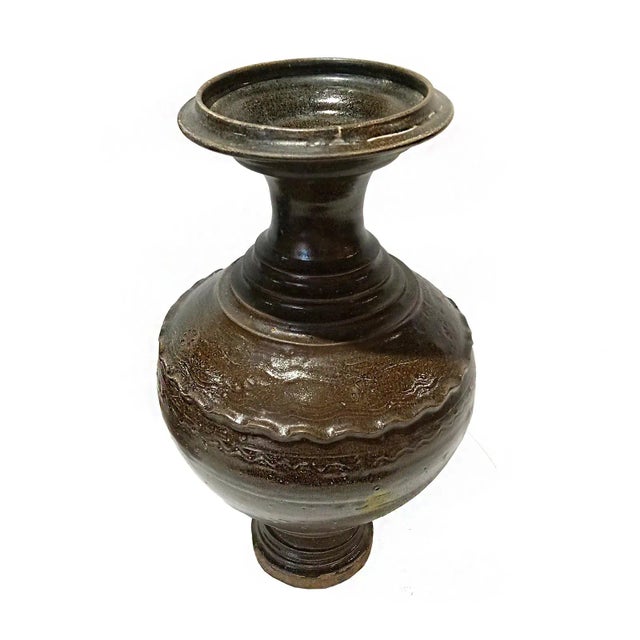 A Thai ceramic vase, glazed in black, early 20th Century. Natural clay / earthenware, same material originally used in...