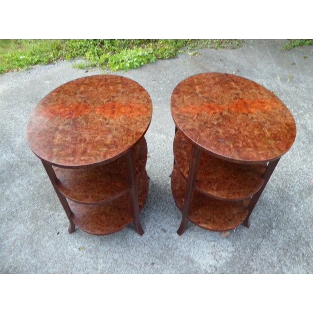Wonderful matching pair of oval walnut burl side tables. Rich book matching tight burls in these 3 tier side or night...