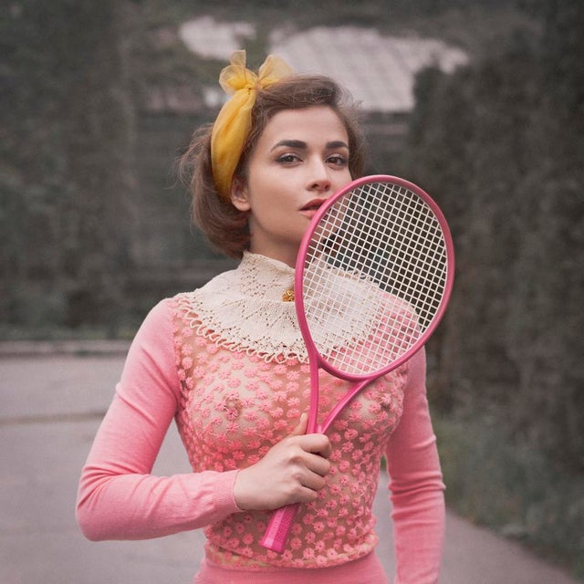 Tennis III by Dasha and Mari Pretty in pink, a model holds her tennis racket posing in pink. Limited edition print...