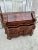 Decorative antique secretary desk in the Baroque Revival/Rococo style, featuring beautifully curved drawer fronts and warm...